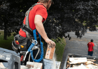 Roofing contractor inspecting a residential roof in Brentwood, TN