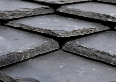 Slate roof tiles being inspected in Huntsville, Alabama